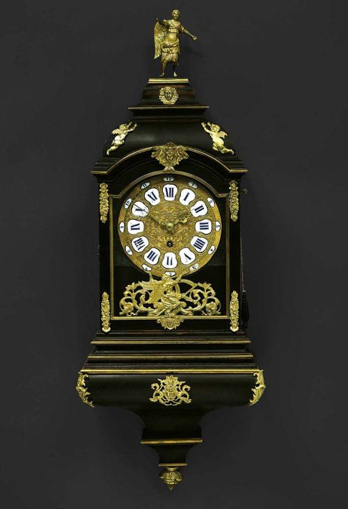 CLOCK ON PLINTH, Louis XV, the case from the workshop of M. FUNK (Mathäus Funk, Murten 1697-1783 Bern), the movement signed and numbered WEPF A BERNE NO. 1 (Joseph Wepf, 1700-1769), Bern circa 1740. Ebonised wood, glazed on three sides with angel atop. Fine relief-decorated bronze dial with enamel cartouches, fine verge escapement striking the 1/2 hours on 2 bells, gilt bronze mounts and applications. 38x20x96 cm. Provenance: Private collection, Zurich. A fine clock in untouched condition.