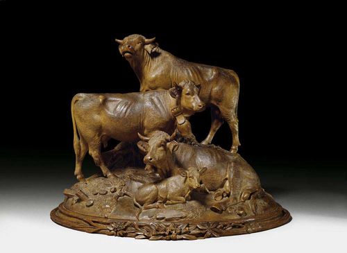 BRIENZ GROUP, attributed to J. HUGGLER (Johann Huggler, active circa 1860), Brienz circa 1860/80. Finely carved walnut. Depicting a bull, 2 cows and 1 calf, on shaped oval plinth. H 43 cm, W 50 cm. Provenance: Private collection, Zurich. An exceptionally rare and high quality group