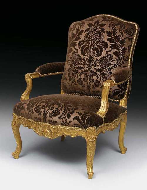 SET OF 6 LARGE FAUTEUILS "A LA REINE", Régence, from a Paris master workshop, circa 1735/40. Finely carved beech with rocaille, cartouches, leaves and frieze, upholstered and with brown silk velour covers with floral pattern. 57x58x46x105 cm. Provenance: from a German collection A highly important suite of perfect quality in very good condition