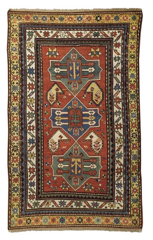 FACHRALO antique. Red central field with three medallions in green and blue, geometric patterned, triple stepped border in yellow, blue and white, professionally restored, 180x110 cm.