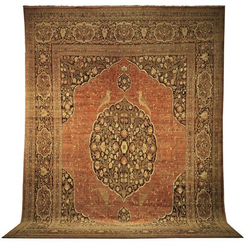 TABRIZ HAJ JALILI antique. Interesting collectors' piece with floral central medallion on old rose ground with dark corner motifs, patterned with flower and bird motifs in pastel colours, broad border with floral cartouches, slight wear, otherwise good condition, 490x325 cm.