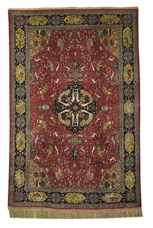 TABRIZ, silk, old. Old rose central field with blue central medallion, decorated with 4 angels, corner motifs with figures, the central field finely decorated with depictions of hunting, blue border with animal cartouches, good condition, 310x205 cm.