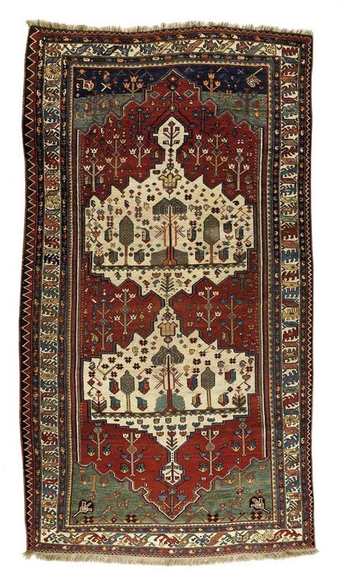 KAZAK old. Two white medallions on red ground with green corner motifs, geometrically patterned with stylized plant motifs, white border, signs of wear, 360x190 cm.