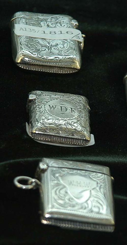 THREE SILVER MATCH BOXES, Birmingham, 1876-1916. Maker's marks. Year stamps for 1876, 1897-98, and 1915-16. Each with cartouche for monogram, two with eyelet for hanging, 3.5 cm, 4 cm, 4.5 cm.