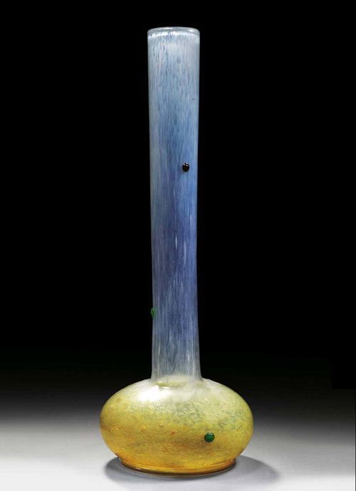 LARGE SLENDER VASE, Daum. Colourless glass with white and yellow inclusions and applied with red and green glass cabochons. Signed Daum Nancy, H. 64 cm.