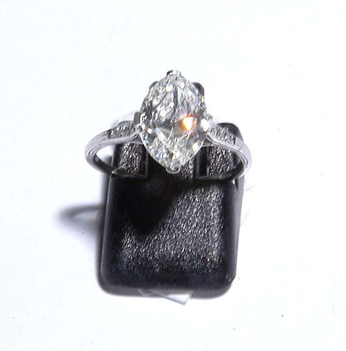DIAMOND RING, ca. 1930. Platinum. Elegant, fine 'Solitaire' model, the top is set with 1 navette-cut diamond of  2.480 ct, G/VS1, flanked by 6 old-mine-cut diamonds totalling ca. 0.06 ct. Size ca. 54. With SSEF Report No. CH 12296, September 2006.