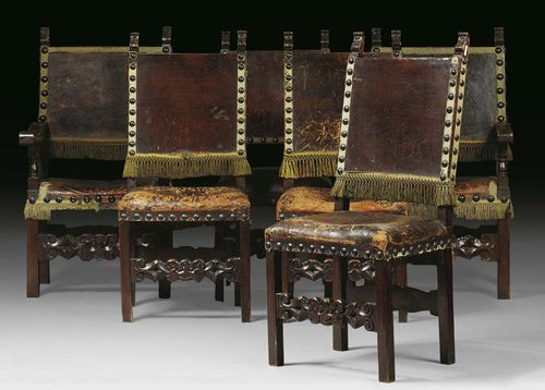 SET OF 6 WALNUT CHAIRS, 2 of which with armrests. Baroque, Northern Italy circa 1700. With dark brown leather covers and decorative nail work. Restored. The armchairs 63x40x44x113 cm, chairs 49x40x52x112 cm. Provenance: Private collection, Basel.