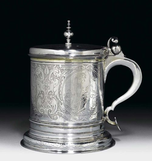 TANKARD AND COVER. Sweden, probably 17th century Maker's mark. Engraved on all sides, with Roman date 1554, gilt interior.  H 20 cm, 910 g.