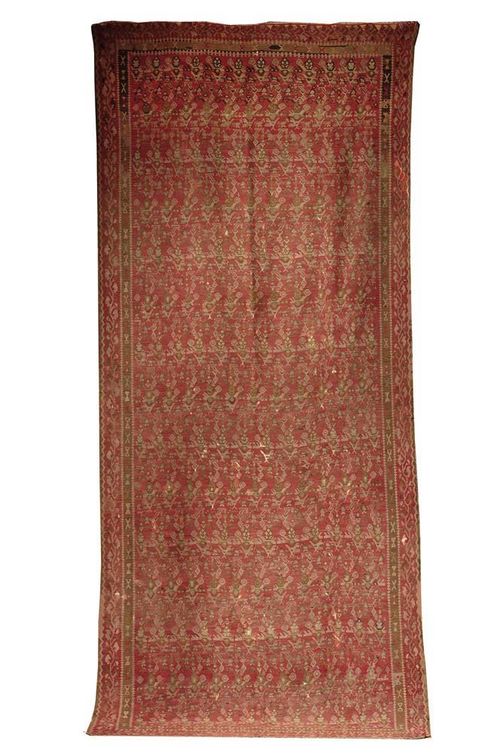 GASHGAI KILIM old. Old-rose ground with stylised floral motif in delicate green tones, narrow border, slight restoration, with some wear, 395 x 170 cm.