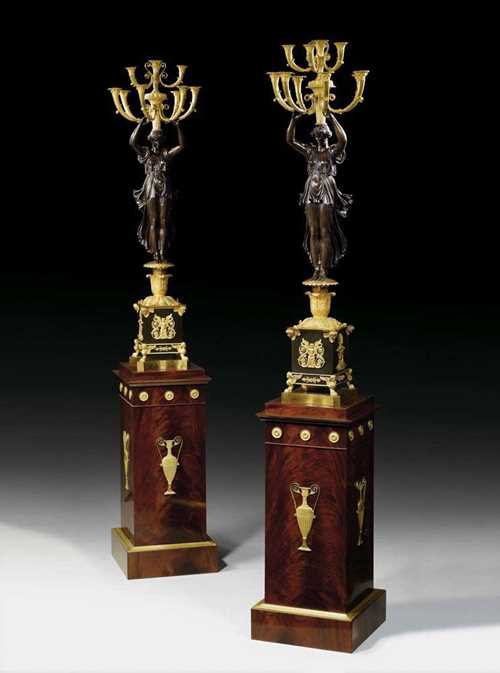 PAIR OF IMPORTANT BRONZE CANDELABRAS "AUX VICTOIRES", Empire, attributed to P.P. THOMIRE (Pierre Philippe Thomire, 1759 Paris 1843) Paris circa 1810. Matte and polished gilt bronze and burnished bronze. With standing victory figure in antique style garments with 8 light branches in the form of cornucopias.  Also Empire style pedestals with bronze applications. H Candelabras 92 cm, with pedestal 136 cm. Provenance: private collection, Belgium