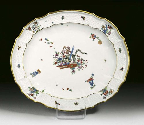 OVAL DISH 'GELBER LÖWE', Meissen, circa 1730-38.' Altbrandenstein ', with a yellow tiger, traditionally called 'gelber Löwe' and scattered Indianische Blumen and insects, crossed swords in underglaze-blue, impressed numeral 27, 39 cm. Provenance: Private collection, Solothurn.