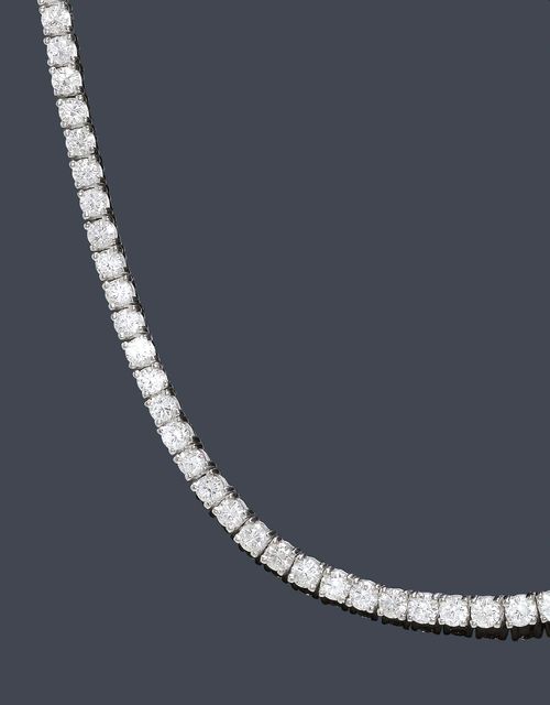 A DIAMOND NECKLACE. White gold 750. A classic "rivière" necklace set with 39 graduated brilliant-cut beautiful quality diamonds of 2,5 to 3.8 mm Ø weighing in total ca. 12.00 ct. L ca. 42 cm.