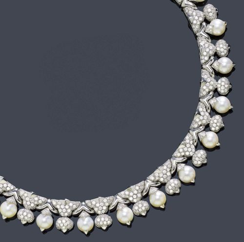 A DIAMOND AND PEARL NECKLACE, BULGARI. White gold 750. Attractive, elegant "tour-de-cou" composed of diamond set ornaments, the links set with 23 mobile cultured pearls with diamond attaches alternated with 22 brilliant-cut diamond beads. Total weight of the brilliant-cut diamonds ca. 35.00 ct. L ca. 36,5 cm. Signed Bulgari. With the original case.