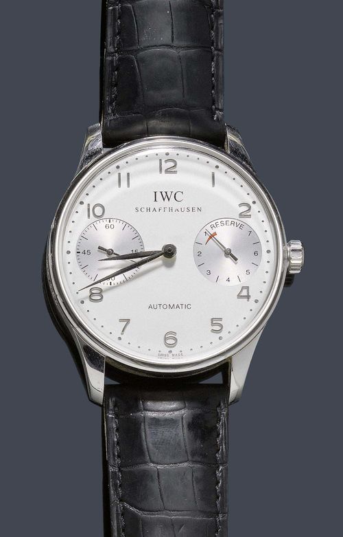 A GENTLEMAN'S WRISTWATCH, AUTOMATIC WITH POWER RESERVE, PORTUGIESER 2000. Platinum 950. Ref. 5000. Limited Millenium series, no. 133 / 250. Platinum case no. 2752144, with transparent case back and convex attaches. Silver colored dial with applied Arabic white gold numerals and gold hands, small second counter at 9:00, 7-day power reserve indicator at 3:00. Automatic with Pellaton-winding, movement no. 2784715, Cal. 5000. Black leather strap with platinum buckle. With box and guarantee, December 2000.