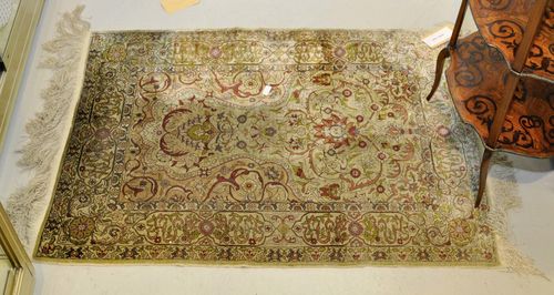 HEREKE old.Light green mihrab with beige spandrels, patterned with trailing flowers and palmettes, light edging, 85x114 cm.