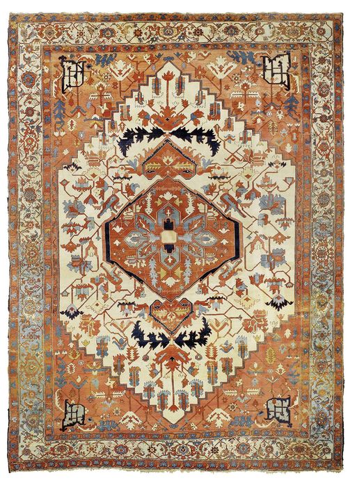 HERIZ SERAPI antique.White ground with a red central medallion and pink corner motifs, patterned with stylized plant motifs in harmonious colours, light blue edging with trailing flowers, signs of wear, 372x480 cm.