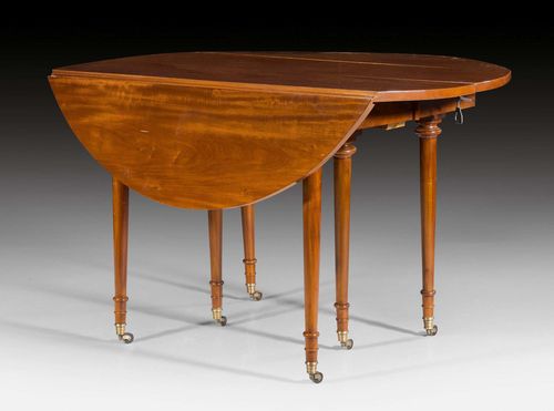 OVAL EXPANDABLE TABLE WITH HINGED LEAVES,late Louis XVI, Paris, early 19th century. Shaped mahogany. On castors. Plus 2 leaves of 47 cm each. 310x125x75 cm. Provenance: from a highly important Swiss private collection.