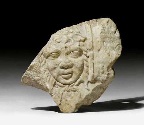 MARBLE FRAGMENT,Roman, probably Asia Minor, 2nd/3rd century AD. Light marble with face of Medusa. W 26 cm. H 25 cm. Provenance: - Sam Dormont, Tel Aviv. - Swiss private collection, acquired 1979.