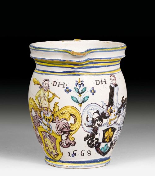 FAIENCE MILK JUG WITH ZURICH MATRIMONIAL COAT OF ARMS,Winterthur, workshop of Hans Heinrich II Pfau, dated 1668. Polychrome painting with the Holzhalb-Hess matrimonial coat of arms and the date 1668 in black. H 17.7 cm. Hairline crack.