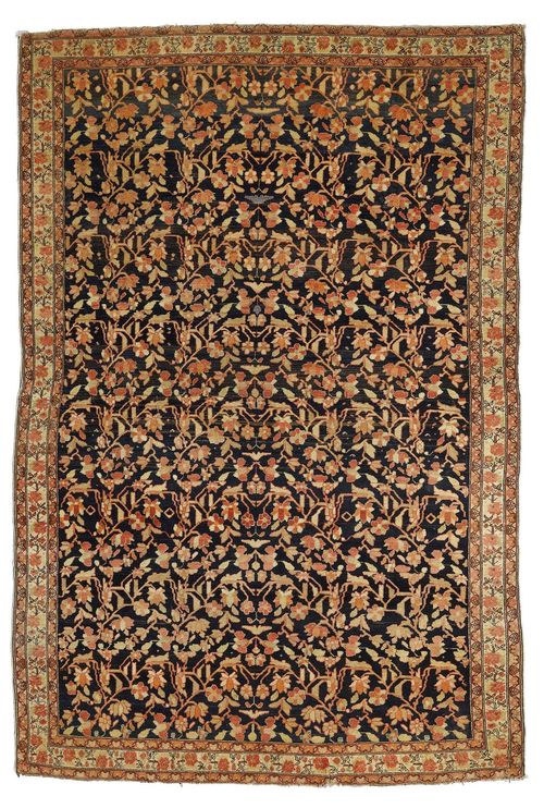 SENNEH antique.Dark blue central field patterned throughout with floral motifs in pink and light green, light border with trailing flowers, 130x197 cm.