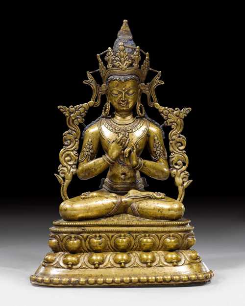 A FINE AND GENTLE BRONZE FIGURE OF TATHAGATA VAIROCANA WITH COPPER INLAYS. Western Tibet, 14th/15th c. Height 31 cm.