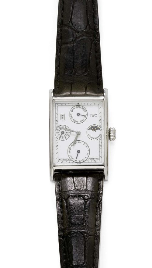 GENTLEMAN'S WRISTWATCH WITH PERPETUAL CALENDAR, IWC NOVECENTO, 1990s. Platinum. Ref. 3545, numbered series No. 494. Rectangular case No. 2489950, with screw-down crown and back. Silver-coloured dial and indices, day, date and month, moon phase at 3h, window with the year at 10-11h. Automatic, movement No. 2481463, Cal. 32062, signed IWC. Original leather band with platinum clasp. Ca. 41 x 27 mm.
