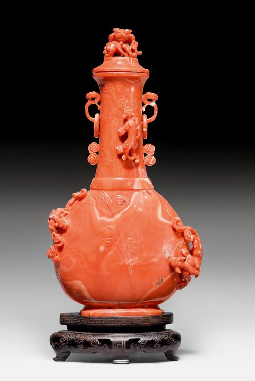 A CORAL VASE AND COVER CARVED WITH CHILONG-DRAGONS.