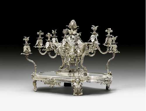 PRINCELY TABLE ORNAMENT, in the R&#233;gence style, stamped ODIOT, with mark and coat of arms of the DE CORDIER DE BIGARS family, Paris ca. 1895. Bronze, silver-plated. 66x53x51 cm.