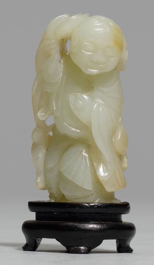 A CELADON JADE FIGURE OF LIU HAI WITH LINGZHI SPRIG AND TOAD.