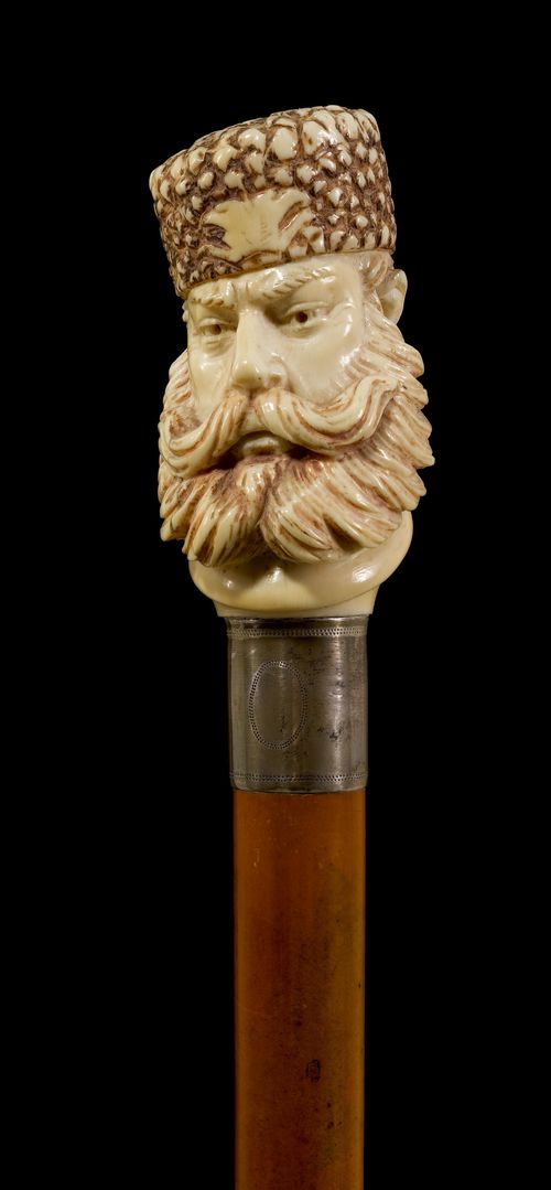 A WALKING STICK WITH IVORY HANDLE,