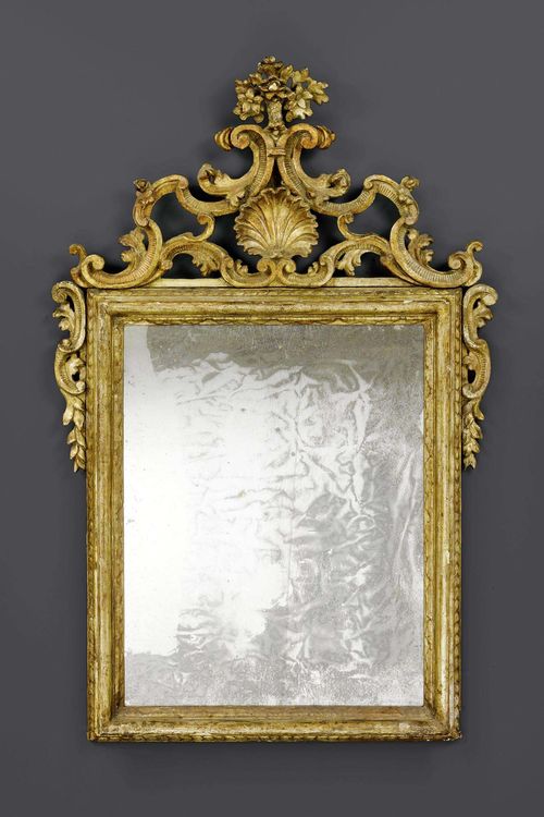 MIRROR "A LA COQUILLE",Baroque, Rome circa 1740. Pierced and richly carved giltwood. H 146 cm. W 90 cm.