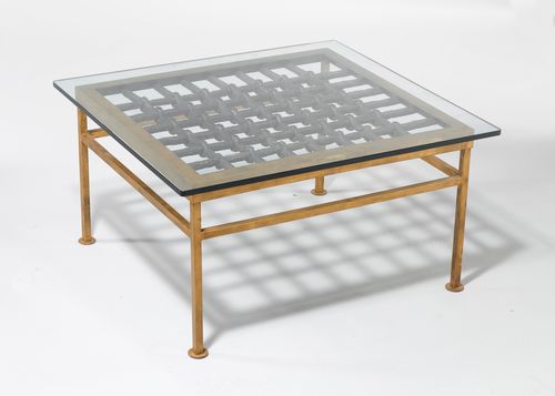 A MODERN SALON TABLE CONSTRUCTED FROM AN OLD WINDOW GRILL,