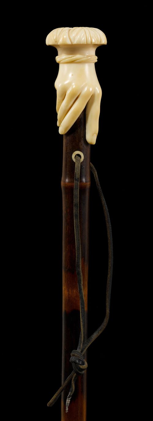 A WALKING STICK WITH HAND KNOB,