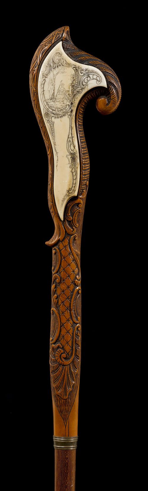 A WALKING STICK WITH INLAID IVORY HANDLE,