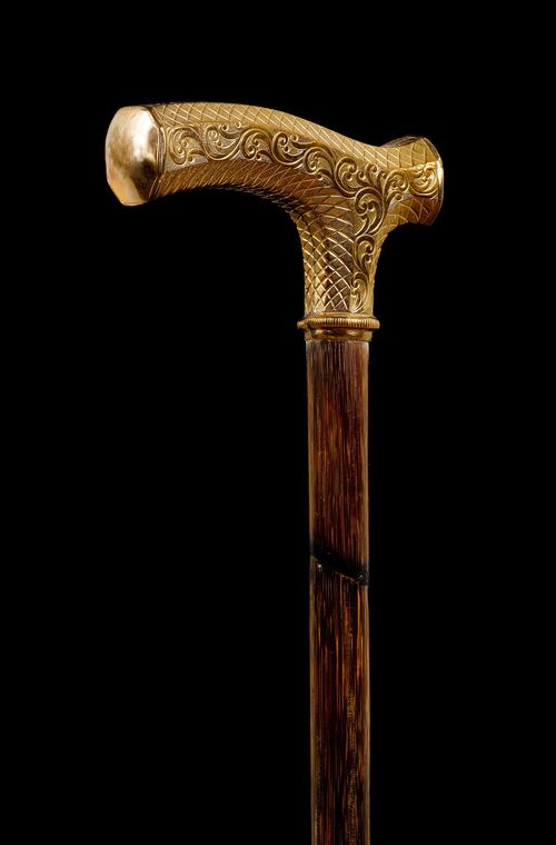 A WALKING STICK WITH GILT HANDLE,