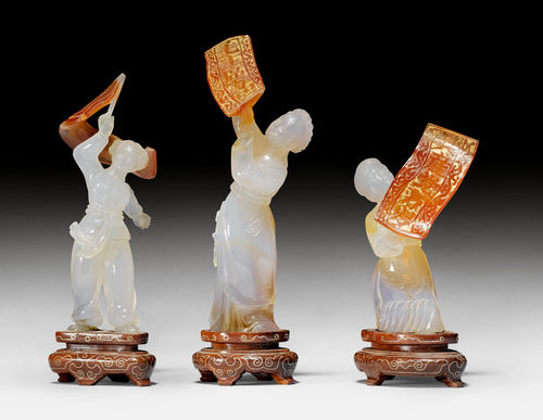 THREE AGATE FIGURES WITH POLITICAL BANNERS.