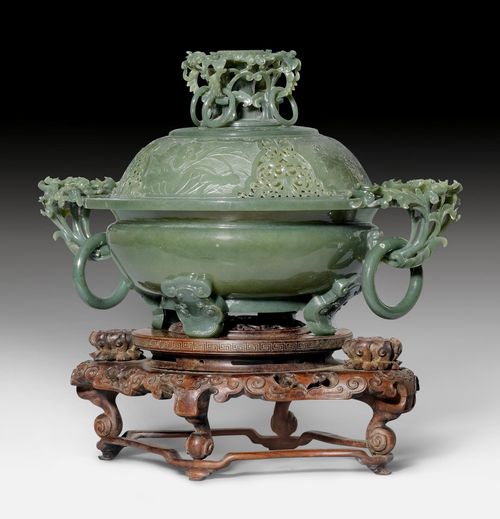 AN EXQUISITE THIN-WALLED PARTLY OPENWORK CARVED DARK-GREEN JADE CENSER AND COVER WITH FLOWER DECORATION.
