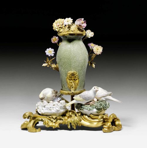 SMALL TABLE FOUNTAIN WITH BRONZE MOUNT,Louis XV, the porcelain in the style of Meissen and Vincennes, 18th century, the bronze Paris, 18th century. The vessel with celadon glaze in Chinese style, small spigot and hinged lid. H 29 cm. W 26 cm. Provenance: - Chrisner collection, New York. - Christie's New York auction, 8.6.1979 (Lot No. 128). - Christie's New York auction, 23.4.1998 (Lot No. 116). - From a European collection.