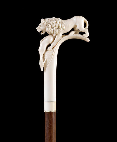 WALKING STICK WITH IVORY HANDLE IN THE FORM OF A LION WITH GAZELLE.