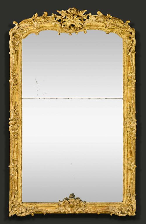 IMPORTANT MIRROR "AUX CARTOUCHES",Louis XV, Paris circa 1750. Pierced and exceptionally finely carved gilt wood with cartouches, flowers, leaves and decorative frieze. H 214 cm, W 112 cm.