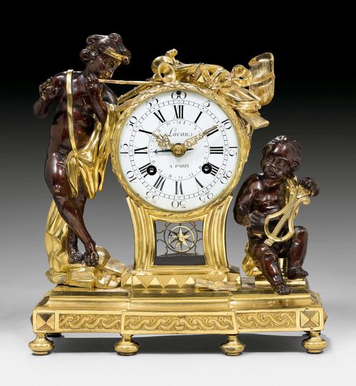 IMPORTANT CLOCK "AUX MUSICIENS",Transition, the dial and movement signed LACAN A PARIS (Henry Lacan, maitre 1756), Paris circa 1765/75. Matte and polished gilt bronze and burnished bronze. Verso fine openwork clock case. The clock with enamel dial and 3 fine gilt hands. Original anchor escapement striking the 1/2 hours on bell. Fine, star pendulum with silk suspension. 34x14x38 cm.