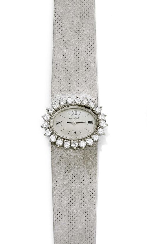 DIAMOND LADY'S WRISTWATCH, GENÈVE, ca. 1970. White gold 585, 46g. Oval case No. 873026 with brilliant-cut diamond lunette weighing ca. 1.00 ct. Silver-coloured dial with Roman numerals and black indices, signed Genève. Hand winder, Cal. ETA 2442. Does not run: resinified. Satin-finished Milanaise band. L ca. 16.3 cm.