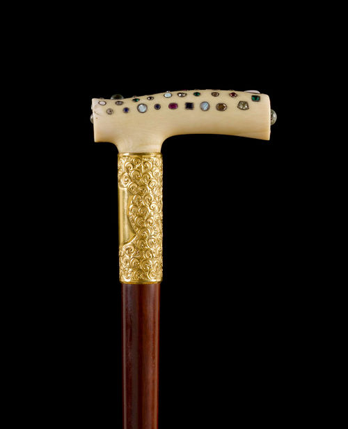 WALKING STICK WITH DECORATED HANDLE.