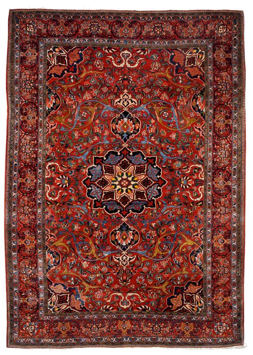 BACHTIAR old.Red ground with a central medallion, patterned with large trailing flowers and palmettes, red edging with trailing flowers, slightly restored in some areas, 305x445 cm.