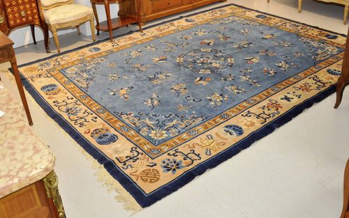 CHINA old.Blue central field decorated with floral motifs, yellow border, 250x325 cm.