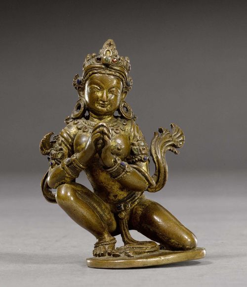 A CHARMING LITTLE COPPER FIGURE OF A GODDESS IN ADORATION. Nepal, 14th c. Height 9.2 cm. Possibly Bhrkuti. Remains of gilding.