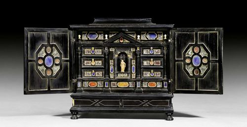 SMALL CABINET WITH MARBLE INLAYS,Renaissance, Rome circa 1700. Ebonized wood inlaid with various types of marble. Hinged and mirror-lined top over compartment. The front with double doors above wide drawer. Fitted interior with Mary figure and drawers. Bronze knobs and handles. 50x35x64 cm. Provenance: - Private collection, Switzerland. - Koller Zurich auction on 30.12.2002 (Lot No. 1019). - From a Roman collection.