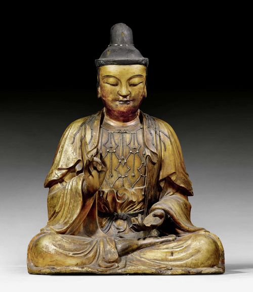 A GILT DRY LACQUER SEATED BODHISATTVA. China, Ming dynasty, height 80 cm. Wooden head and hands, black lacquer. One finger and strands of hair broken off, minor chips.