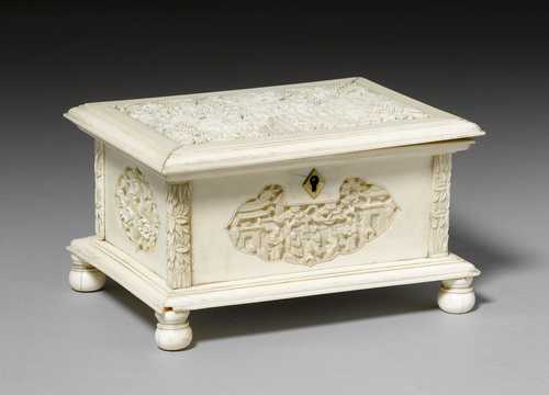 A RECTANGULAR IVORY BOX CARVED WITH A GARDEN SCENE AND CARTOUCHES OF FIGURES AND FLOWERS.