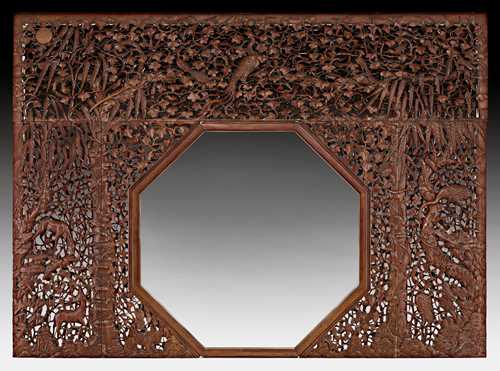 A MAGNIFICENT CAOHUALI IMPERIAL PALACE PARTITION WITH OCTAGONAL DOORWAY CARVED IN OPEN WORK.